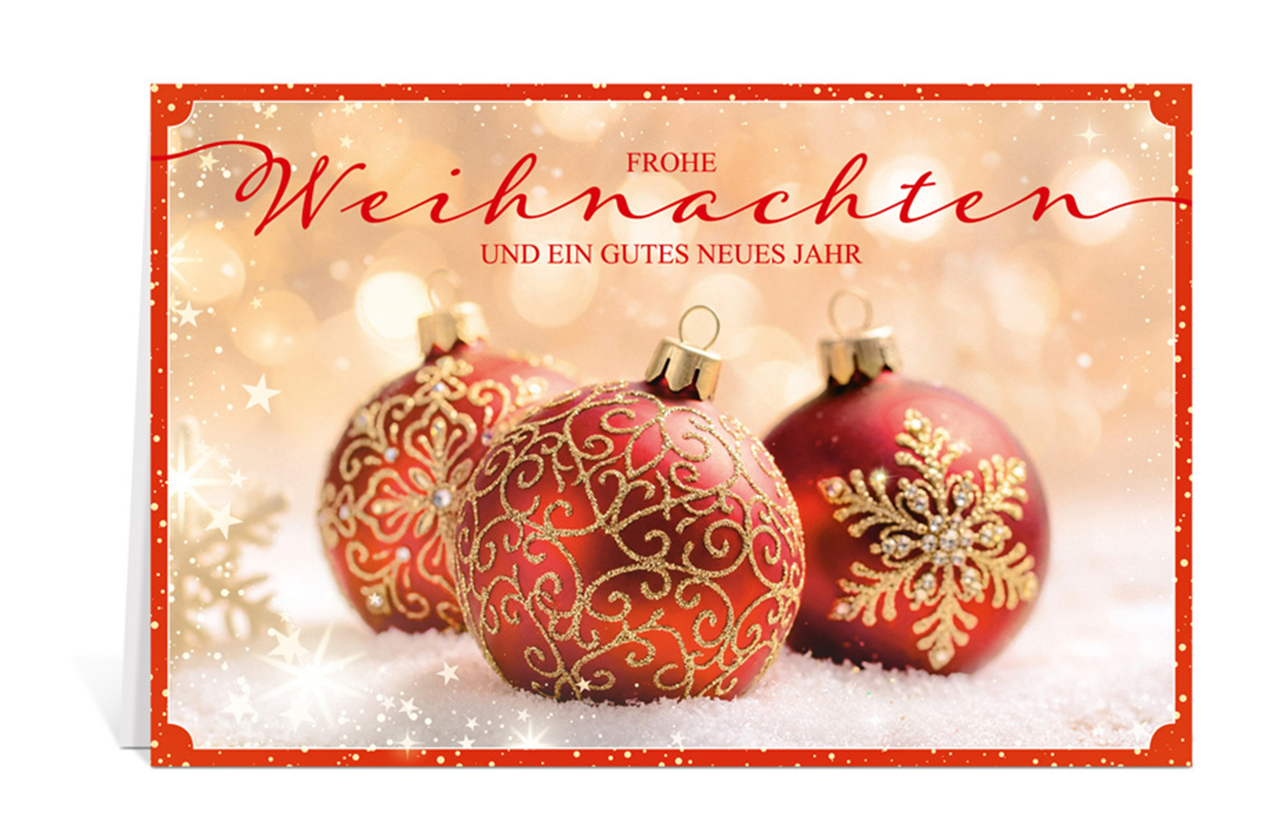 Weihnachtskarte mit drei rot-goldenen Christbaumkugeln im Schnee, goldener Hintergrund und der Text: Frohe Weihnachten und ein gutes neues Jahr