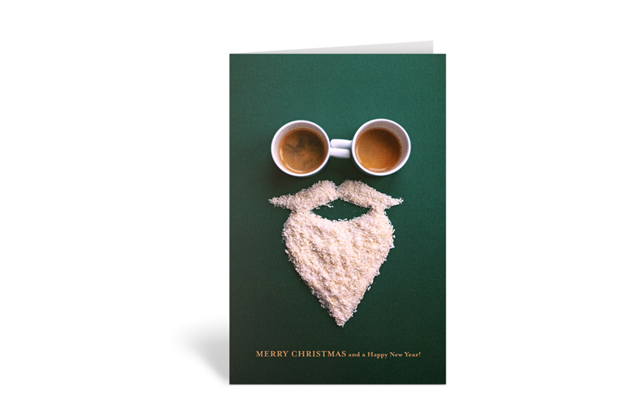 Grüne Weihnachtskarte mit zwei Kaffeetassen als Augen und einem weißen Bart, mit dem Text: Merry Christmas and a Happy New Year!