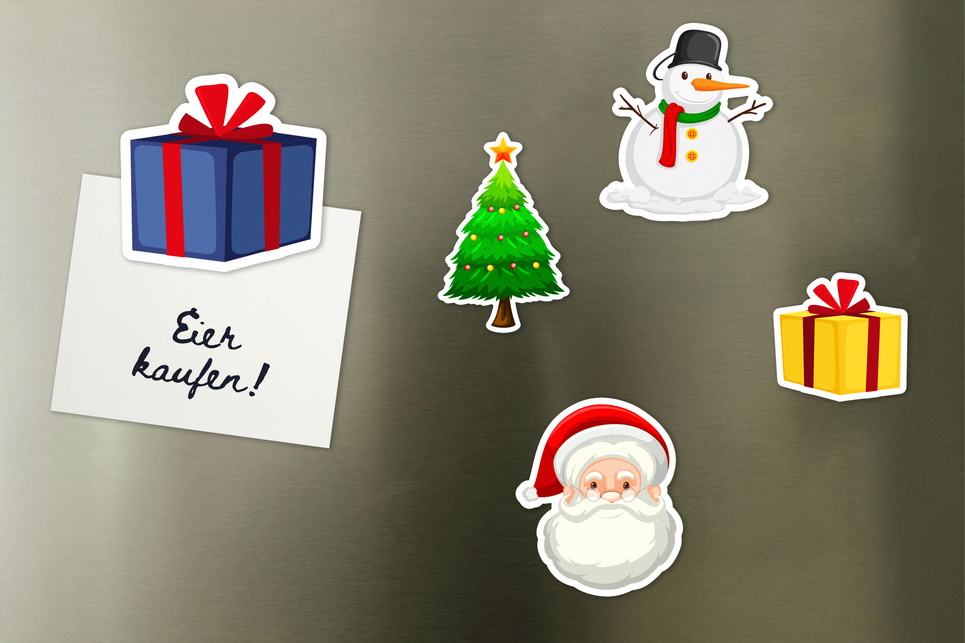 Weihnachtsmagnete Verschiedene Magnete mit Weihnachtsmotiven hängen an einem Kühlschrank mit einem Notizzettel