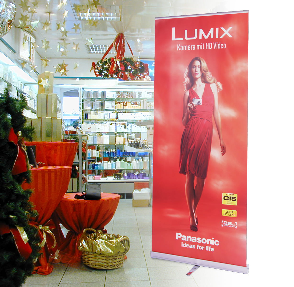 Rollup Easyroll Panasonic Roll-Up Banner im Design Panasonic mit Frau und Kamera