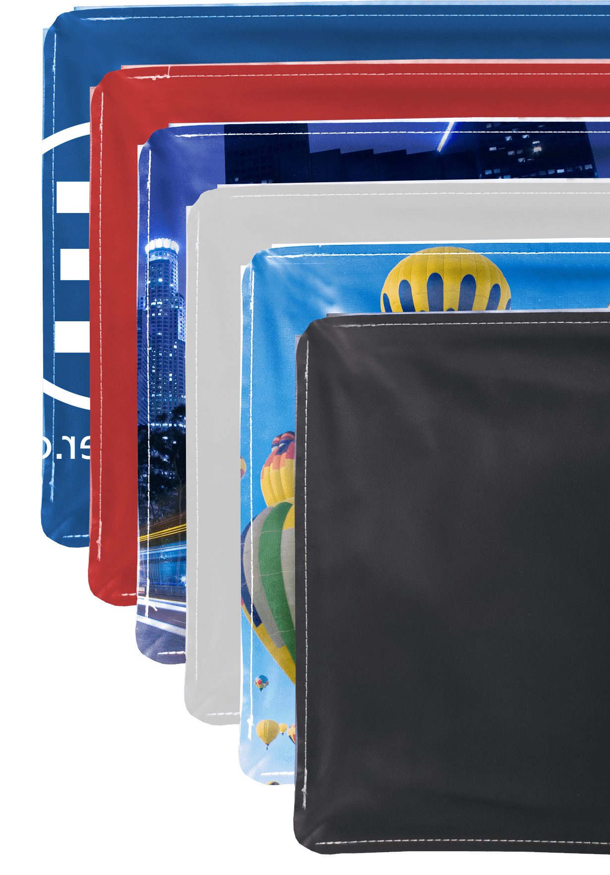 Messewand Easyframe Stoffe Verschiedene Stoffe für die Messewand Easyframe in verschiedenen Farben und Designs, darunter ein Stadtbild und Luftballons.
