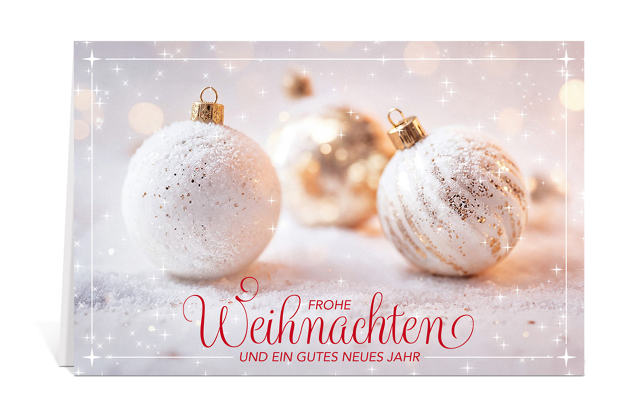 Weihnachtskarte mit weiß-goldenen Weihnachtskugeln auf Schnee und dem Text: Frohe Weihnachten und ein gutes neues Jahr
