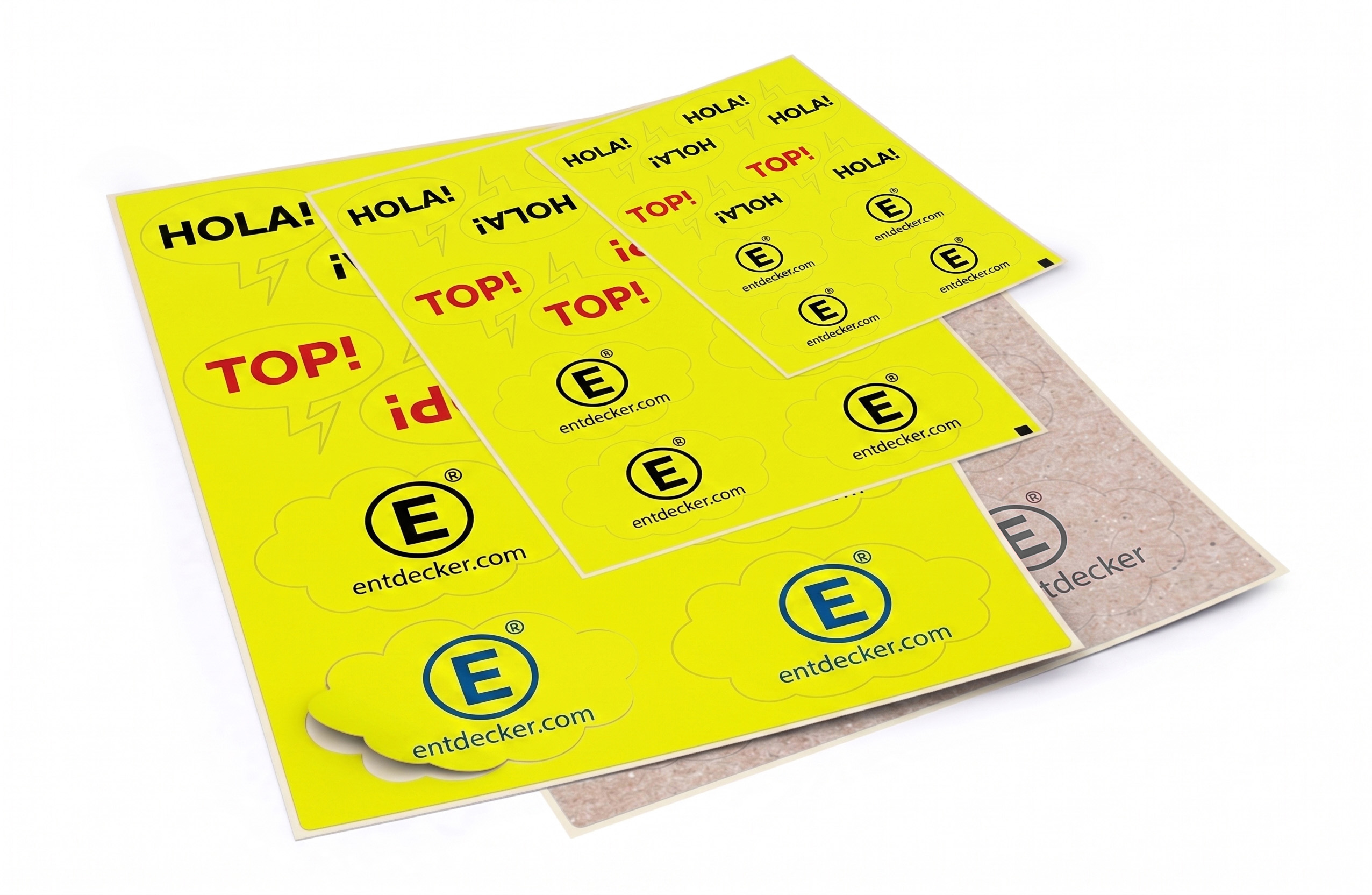 Mehrere überlappende gelbe Stickerbögen mit Aufklebern in verschiedenen Größen, darunter mit den Schriftzügen „HOLA!“, „TOP!“ und entdecker.com-Logos in Schwarz, Rot und Blau.
